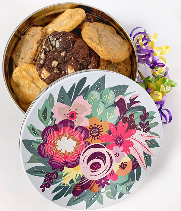 Felix & Norton Cookies - Blooming Bouquet Tin. White background with a floral bouquet in shades or pink, yellow and green